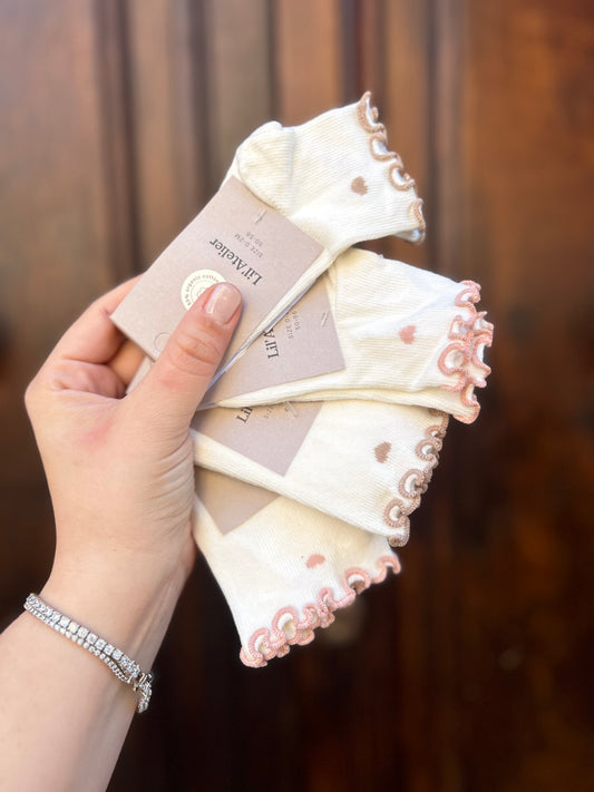 Calzino con rouches e cuore